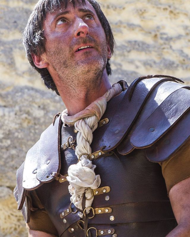 Andy Gathergood in a leather armor in a film set.